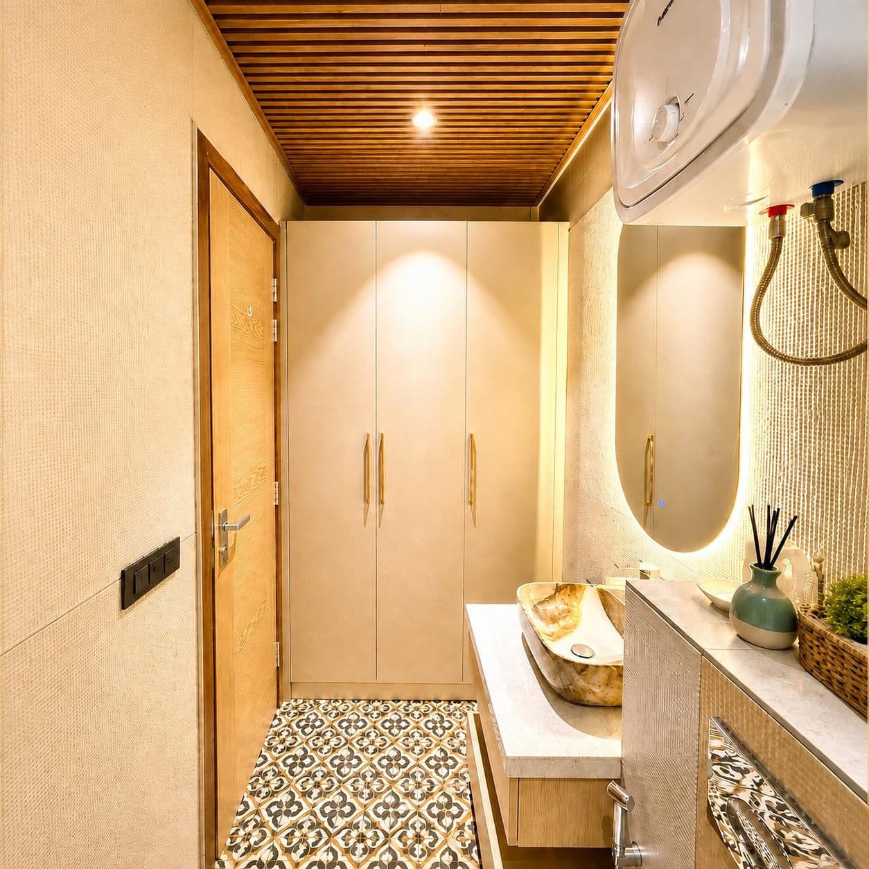 Entryway with built-in wardrobe leading through to the bathroom vanity